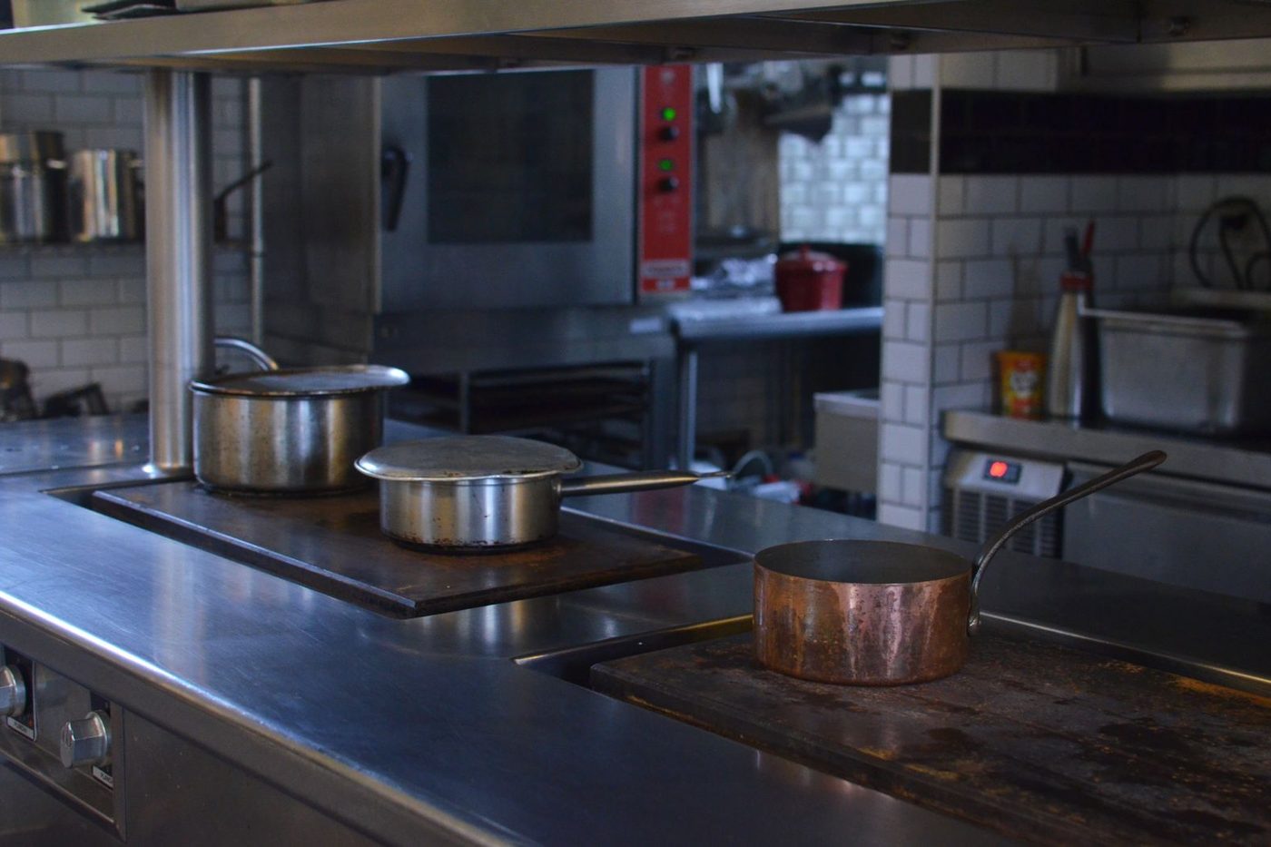 Commercial kitchen in a Phoenix restaurant being inspected for cockroaches